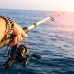 Fishing rod against the sea water surface. sea fishing. copyspace